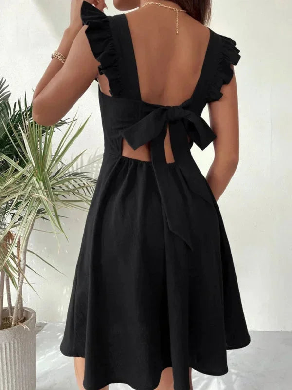 Robe courte évasée à volants et manches à bretelles, en coton léger, parfaite pour l'été. Plusieurs couleurs disponibles.