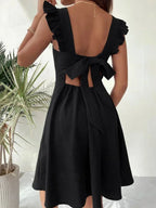 Robe courte évasée à volants et manches à bretelles, en coton léger, parfaite pour l'été. Plusieurs couleurs disponibles.