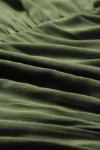 Robe courte volantée en coton avec lacets et manches longues, idéale pour les journées d'automne.