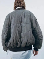 Veste bomber femme oversize matelassée gris avec boutons-pression, conçue pour un style décontracté.