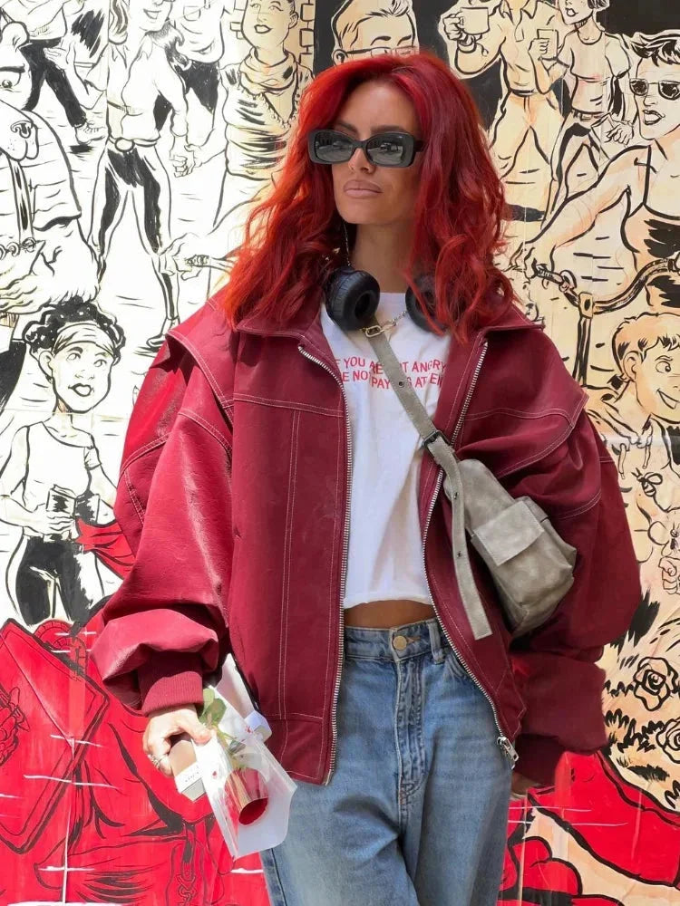 Veste bomber oversize femme marron à fermeture éclair, design classique avec des poignets élastiques.