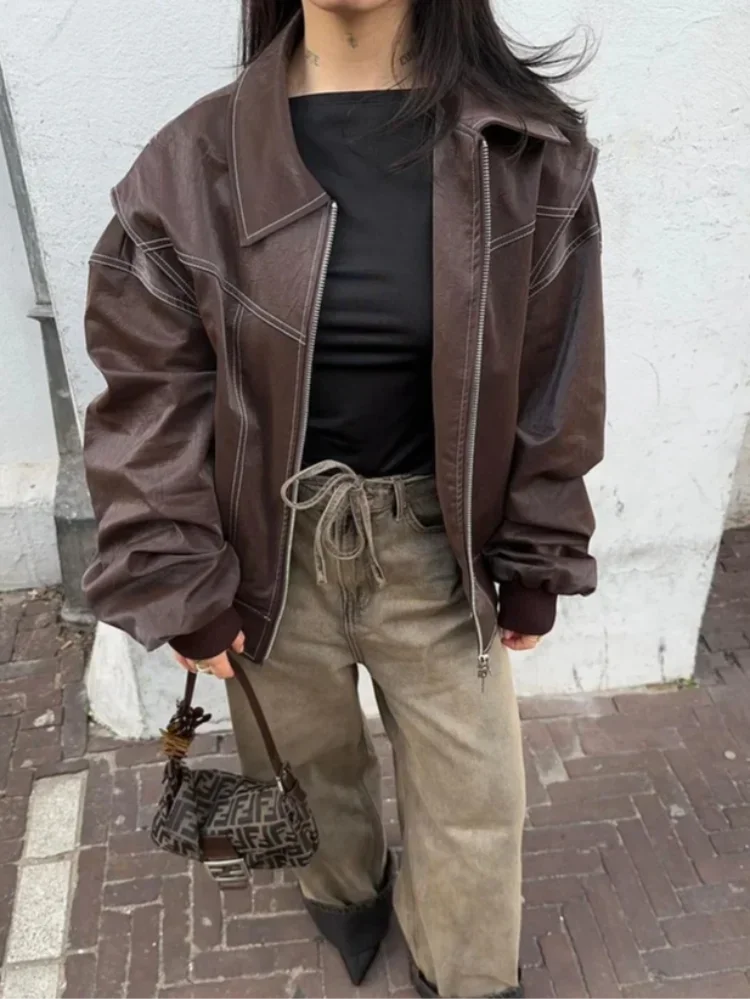 Veste bomber oversize femme marron avec fermeture éclair et poignets élastiques pour un confort optimal.