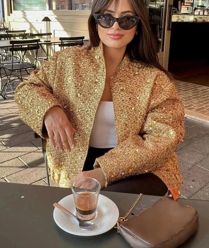 Veste femme noire à paillettes, coupe ajustée, idéale pour les occasions spéciales.