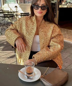 Veste femme noire à paillettes, coupe ajustée, idéale pour les occasions spéciales.