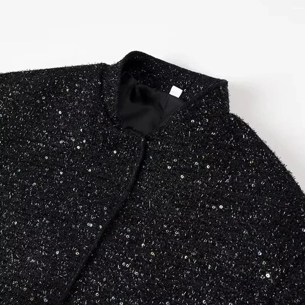 Veste femme à paillettes brillantes, coupe élégante, en tissu doux pour des occasions habillées.