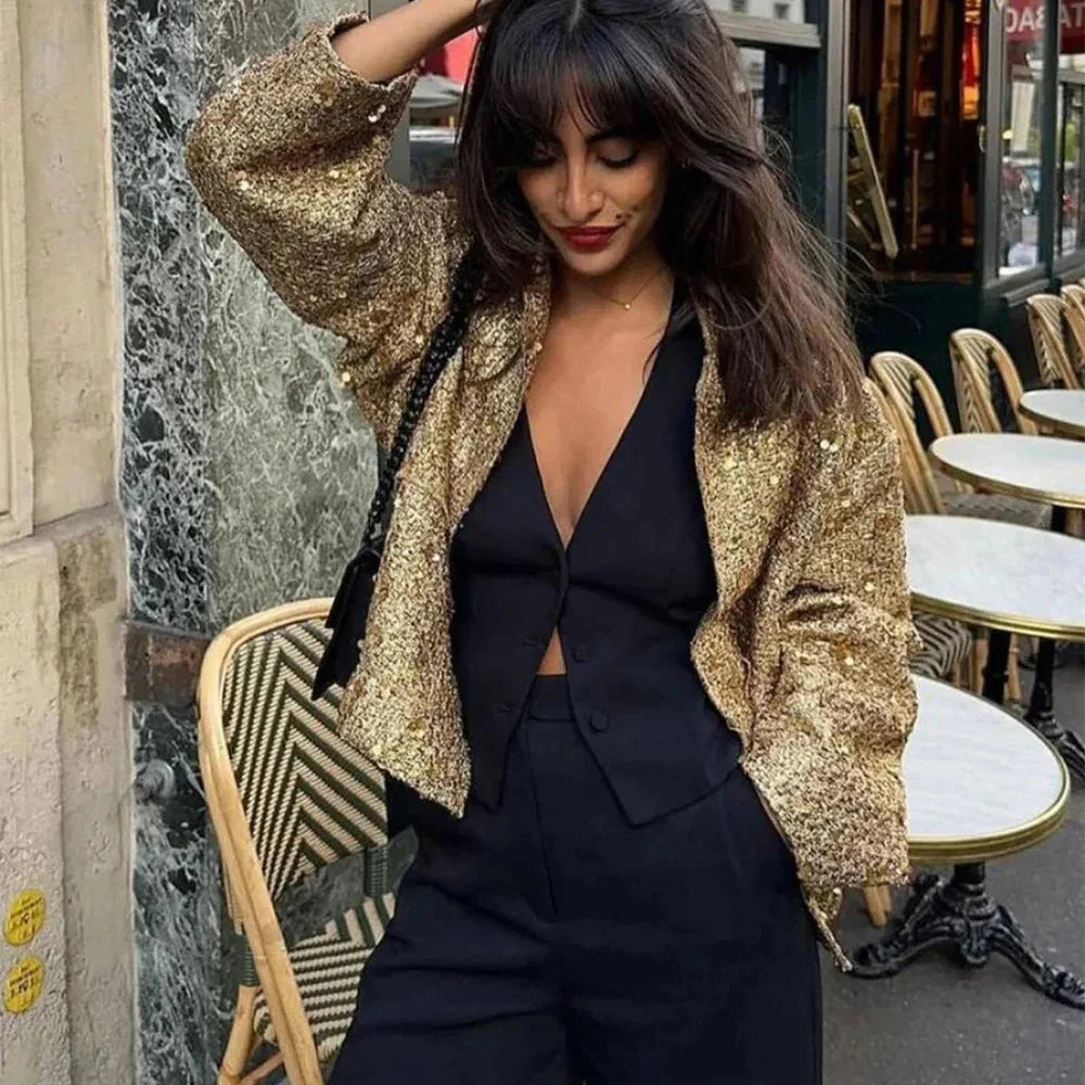 Veste femme dorée à paillettes, coupe élégante, en polyester pour un style unique.