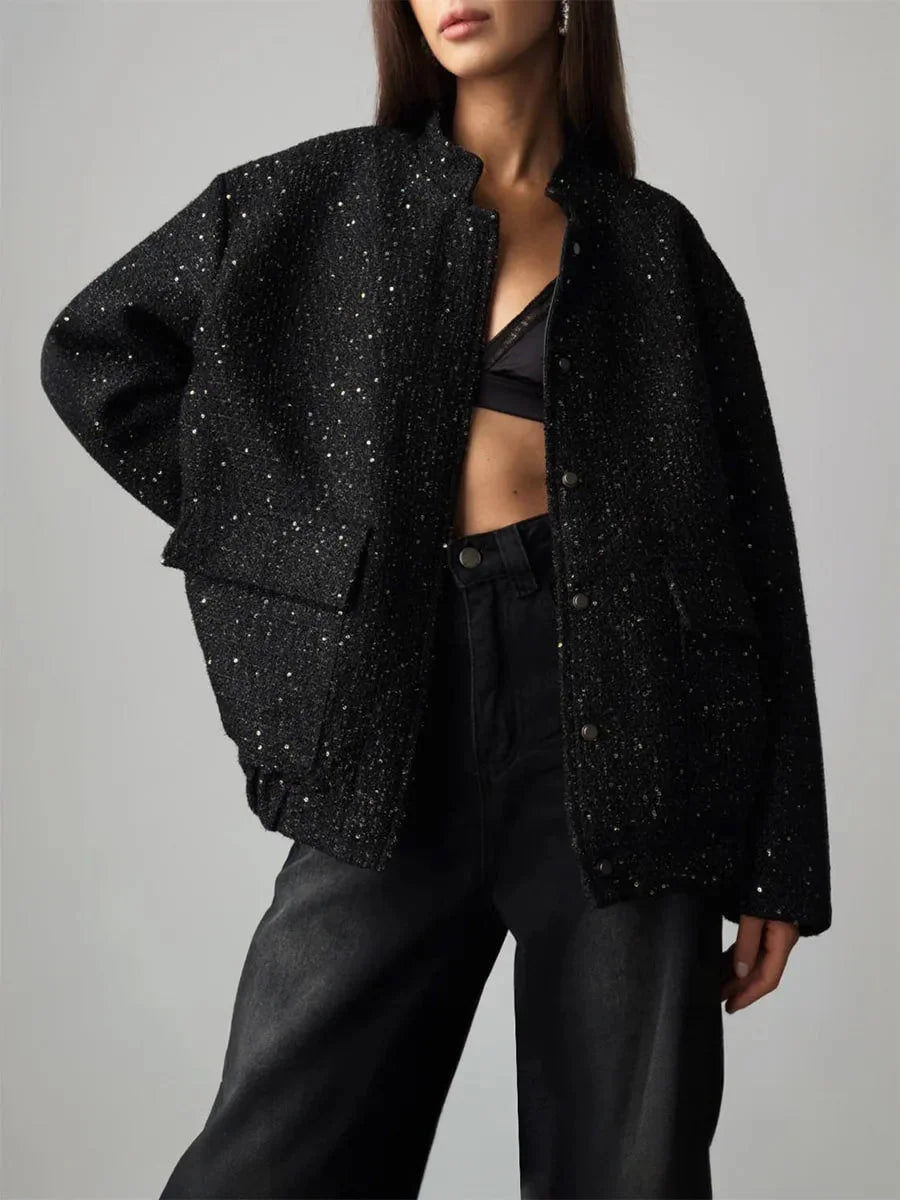 Veste femme à paillettes, coupe élégante et ajustée, adaptée pour des occasions festives.