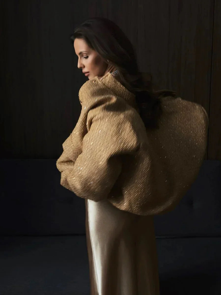 Veste femme à paillettes, coupe élégante, idéale pour les occasions festives.