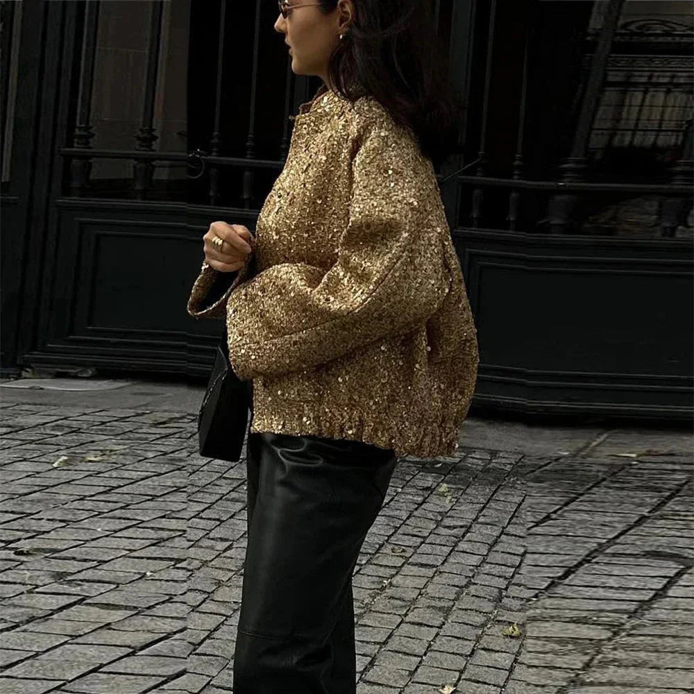 Veste femme à paillettes, coupe ajustée, design élégant et scintillant pour une tenue raffinée.
