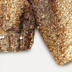 Veste femme à paillettes avec coupe ajustée, idéale pour les occasions spéciales et les tenues de soirée.
